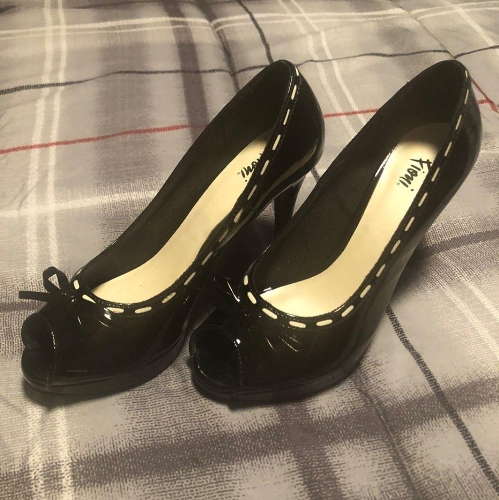 black patent leather with white trim pump
